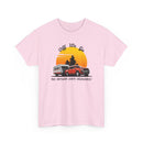 Pink t-shirt with a graphic of a caravan and 4WD off into the sunset design 